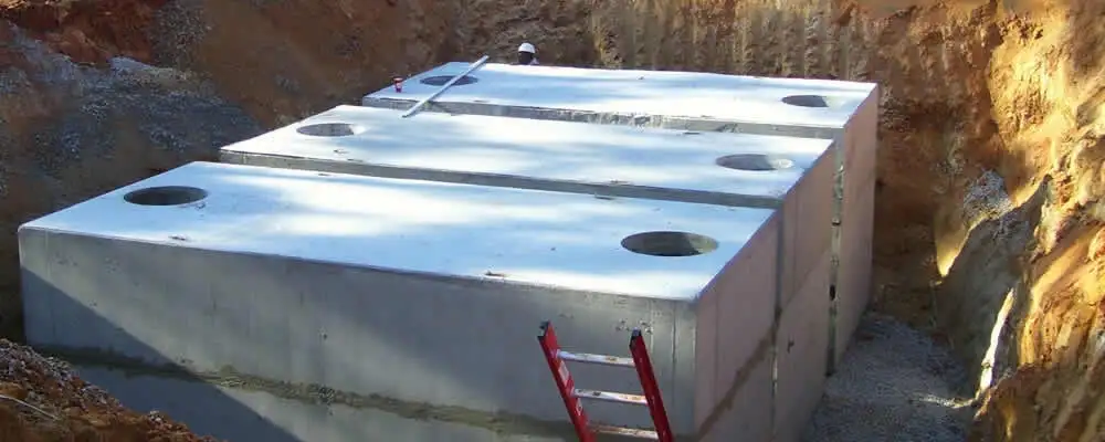Septic tank installation site with a newly placed concrete tank in El Paso, TX